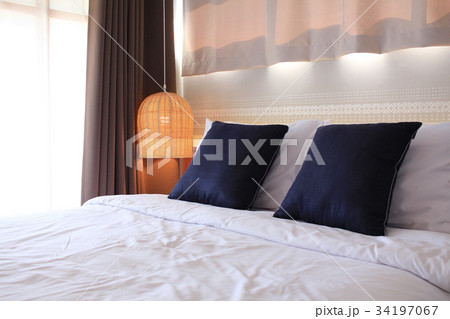 Bedroom with rattan lamp 34197067