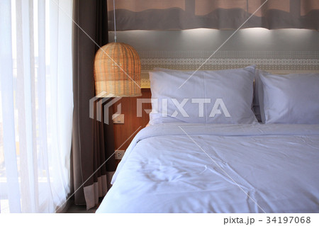 Bedroom with rattan lamp Bedroom with rattan lamp 34197068