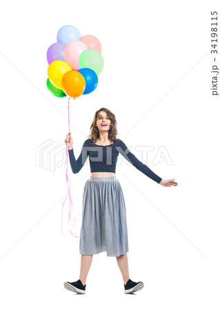 Surprised beautiful woman holding colorful balloons and having f Surprised beautiful woman holding colorful balloons and having f 34198115