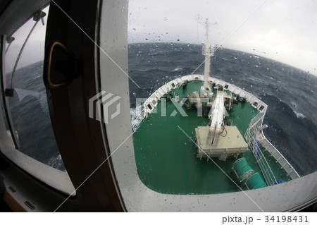 Ship's Bow diving into a big splashing wave Ship's Bow diving into a big splashing wave 34198431