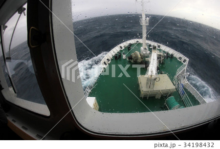 Ship's Bow diving into a big splashing wave 34198432