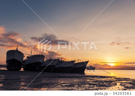 big transport boats in the morning sunrise. 34203561