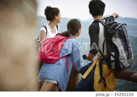 The man is pointing and showing his friend their next destination. 34205220