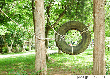 Swings made of tires in  Boy Scout camp 34208718