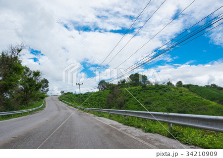 road and clouds on blue sky in summer day road and clouds on blue sky in summer day 34210909