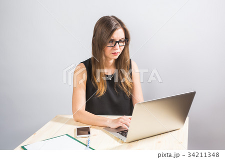 business concept - businesswoman working on laptop business concept - businesswoman working on laptop 34211348