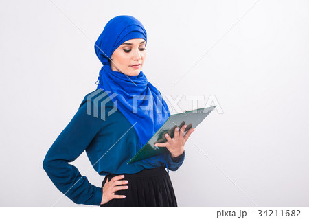 Arab Student holding a folder Arab Student holding a folder 34211682
