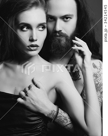 Beautiful Couple With Tattoo Sexy Woman And Manの写真素材