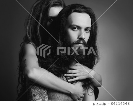 hipster couple with tattoo.woman and man in hugs 34214548