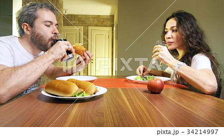 Young caucasian man and woman drinking carbonated 34214997
