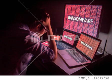 Asian male frustrated by ransomware cyber attack 34215758