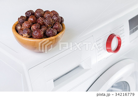 soap nuts in a bowl on the washing machine soap nuts in a bowl on the washing machine 34216779