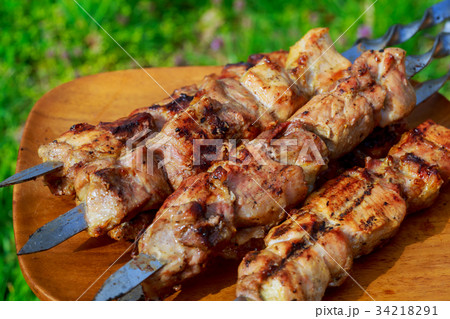 closeup some meat skewers being grilled barbecue 34218291