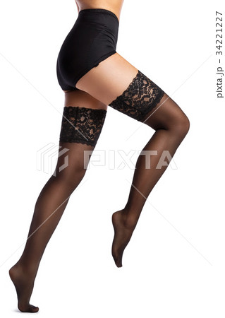 Beautiful female legs in black stockings Beautiful female legs in black stockings 34221227