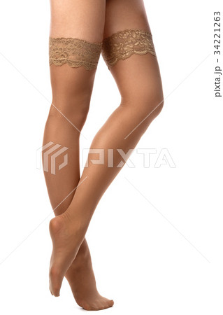 Female legs in nude stockings 34221263