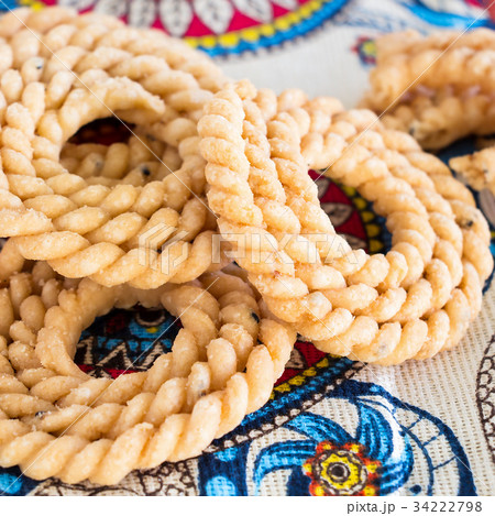 Butter Chakli with spicy famous South Indian Snack Butter Chakli with spicy famous South Indian Snack 34222798