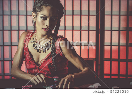 Sexy and happy female poker player Sexy and happy female poker player 34225016
