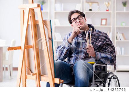 Disabled artist painting picture in studio Disabled artist painting picture in studio 34225746