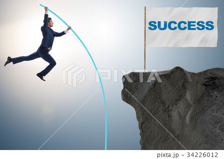 Businessman pole vaulting towards his success goal 34226012