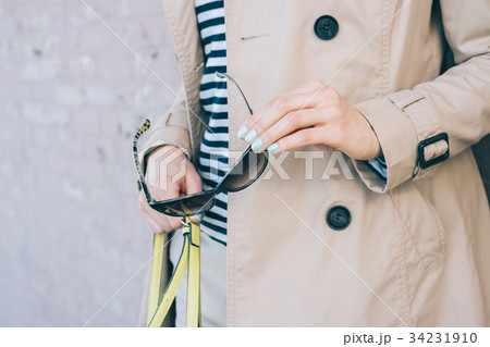 Cropped image of woman in coat 34231910