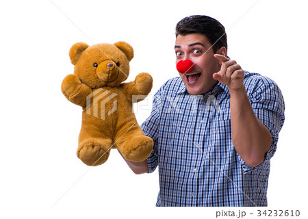 Funny clown man with a soft teddy bear toy Funny clown man with a soft teddy bear toy 34232610