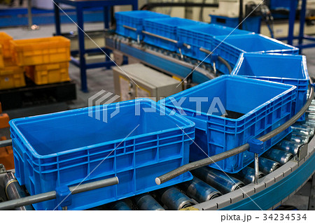 Plastic box on roller line for tranfer production Plastic box on roller line for tranfer production 34234534