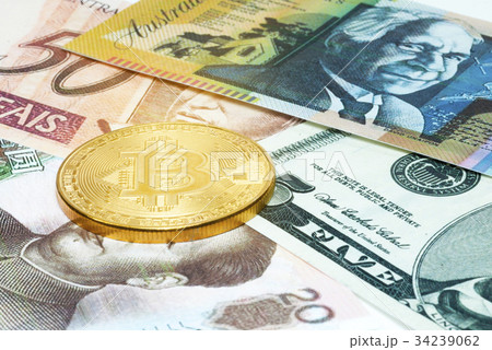 Golden Bitcoin coin on close up 34239062