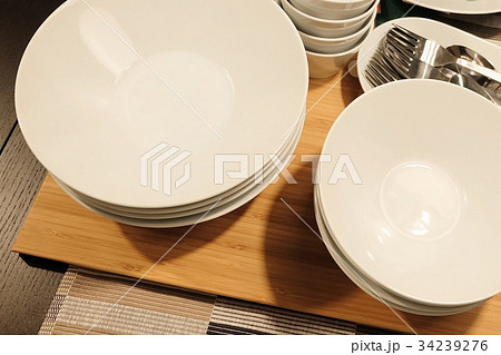 Set of Porcelain Plates, Bowls and Silverware 34239276