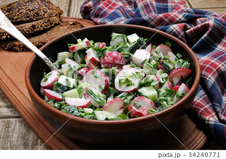 Salad from radish and cucumber 34240771