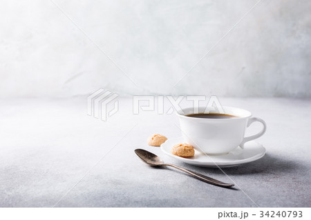 White cup of coffee with amaretti cookies 34240793