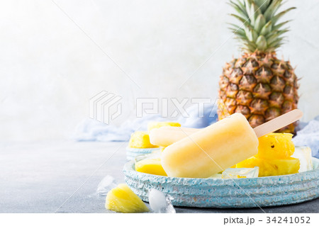 Homemade pineapple popsicles 34241052