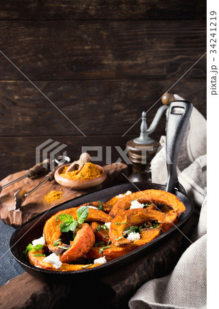Roasted pumpkin with addition aromatic herbs Roasted pumpkin with addition aromatic herbs 34241219