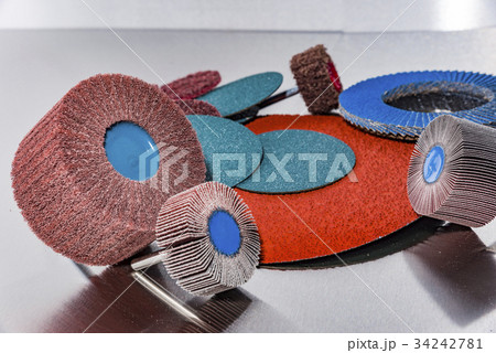 Flap Wheel. A pile of color abrasive sandpaper for 34242781