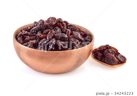 Dried raisins in bowl isolated on white Dried raisins in bowl isolated on white 34243223