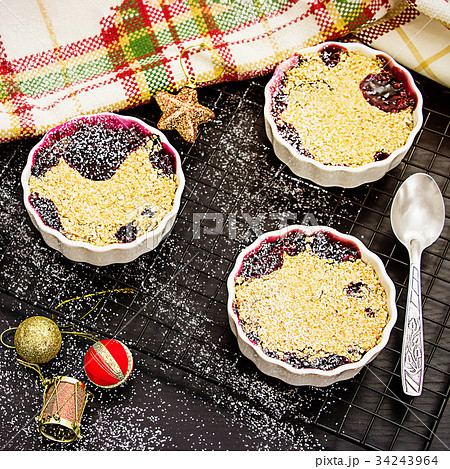 Three Homemade delicious crumble with berries Three Homemade delicious crumble with berries 34243964