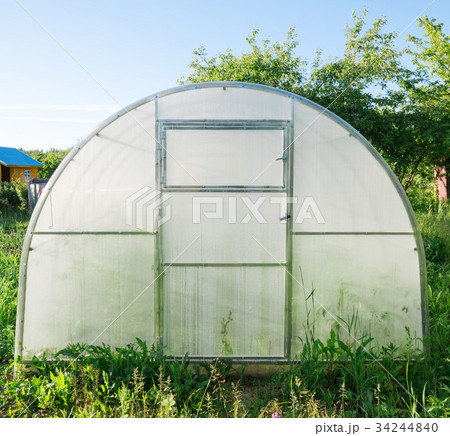 Greenhouse made of polycarbonate in the garden 34244840