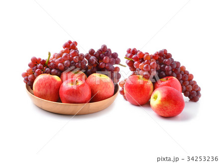 ripe red apples and grapes on white 34253236