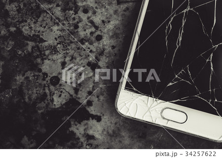Smartphone with a broken screen. 34257622