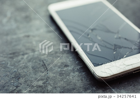 Smartphone with a broken screen. 34257641