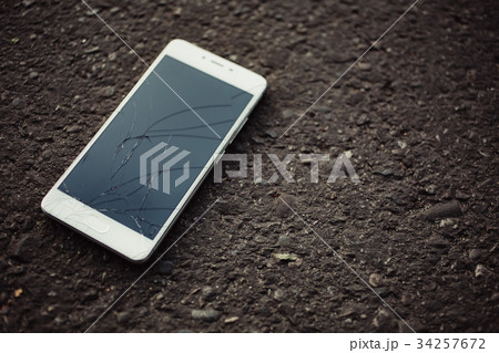 Smartphone with a broken screen. 34257672