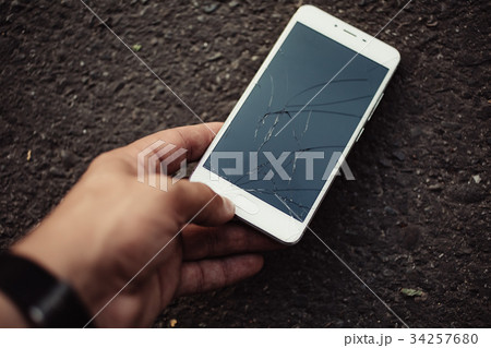 Smartphone with a broken screen. 34257680