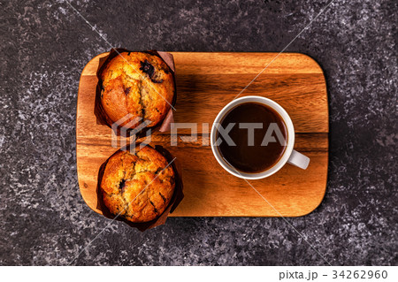 Table with muffins and coffee. 34262960
