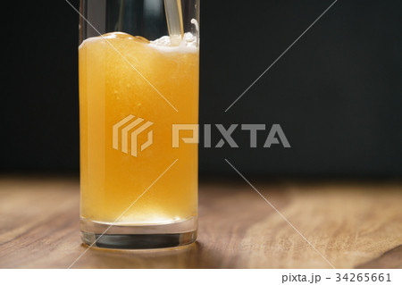 wheat unfiltered beer poured into glass on wood 34265661
