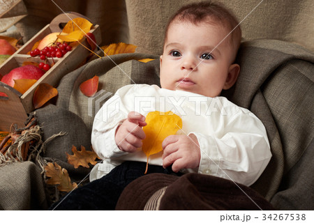autumn season, child boy lie on yellow fall leaves 34267538