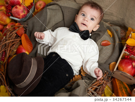 autumn season, child boy lie on yellow fall leaves 34267544