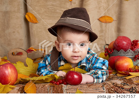 autumn season, child boy lie on yellow fall leaves autumn season, child boy lie on yellow fall leaves 34267557