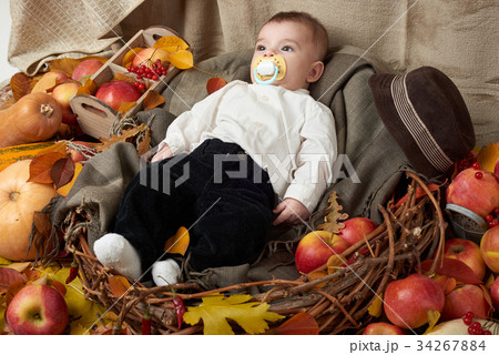 autumn season, child boy lie on yellow fall leaves autumn season, child boy lie on yellow fall leaves 34267884