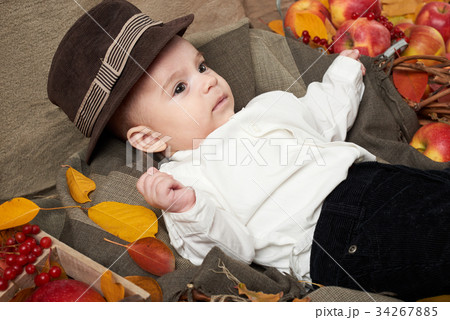 autumn season, child boy lie on yellow fall leaves autumn season, child boy lie on yellow fall leaves 34267885