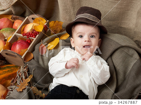 autumn season, child boy lie on yellow fall leaves autumn season, child boy lie on yellow fall leaves 34267887