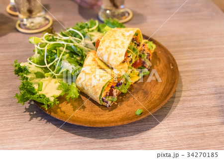 fresh tortilla wraps with vegetables on the plate 34270185